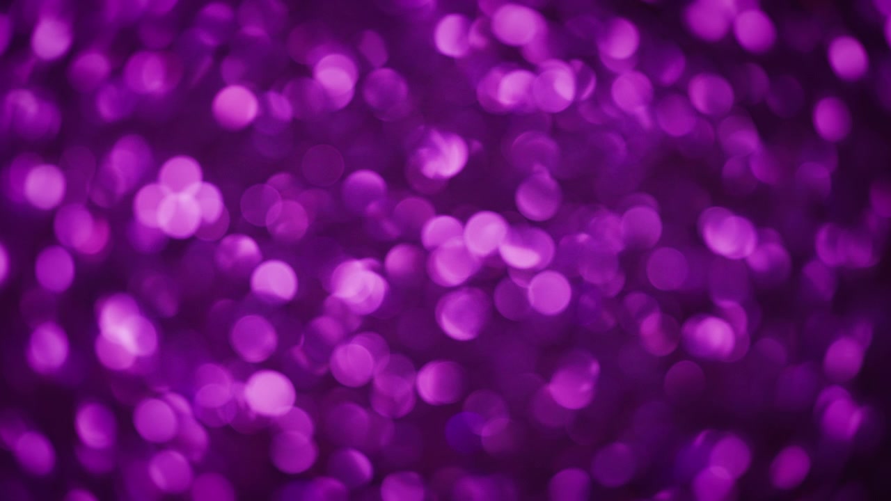 Abstrakt bokeh-baggrund af funklende lilla glimmer