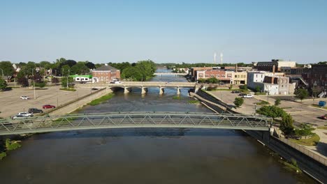 low aerial view along raisin river, through monroe michigan