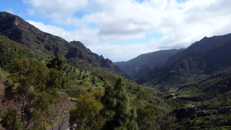 Drone-shot-flying-over-mountain-road-with-beautiful-nature-landscape