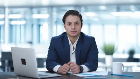 indian businessman looking at the camera