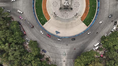overhead shot of angel of independence, featuring a base decorated with marigold flowers