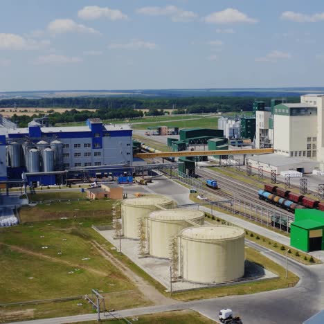 modern agro-processing plant. granary elevators. silver silos on manufacturing for processing drying cleaning and storage of agricultural products.