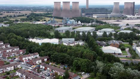 british industrial residential neighbourhood aerial view across power station suburban houses and streets tilt up