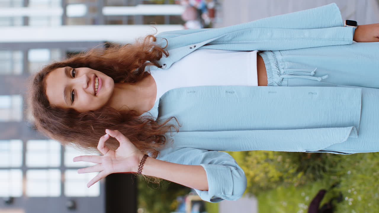 Happy cheerful child girl showing ok gesture positive like sign approve something good celebrate