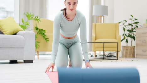 Yoga,-home-and-woman-roll-mat-to-start-exercise