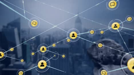 Animation-of-network-of-digital-icons-against-aerial-view-of-cityscape