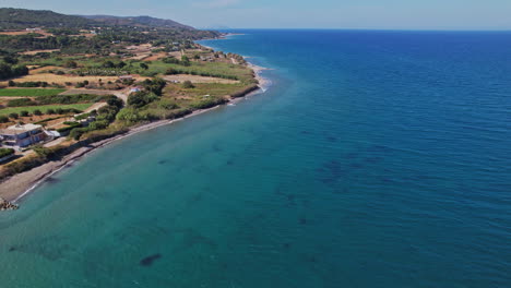 aerial view of a serene coastal landscape with clear blue waters