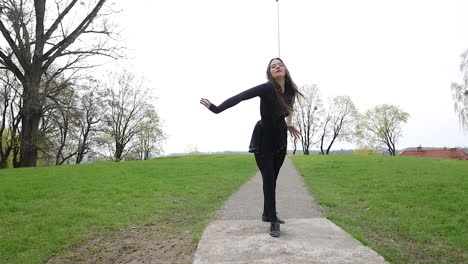 dance performance by a young woman in a natural location