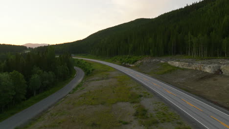 asphalted e6 highway through forested mountains in northern norway