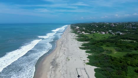 drone aerial landscape of la barra de colotepec waves breaking on sandy ocean beach in puerto escondido mexico central america surfing travel tourism nature