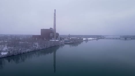 trenton channel coal power plant closed to reduce emissions, aerial drone view moody winter day