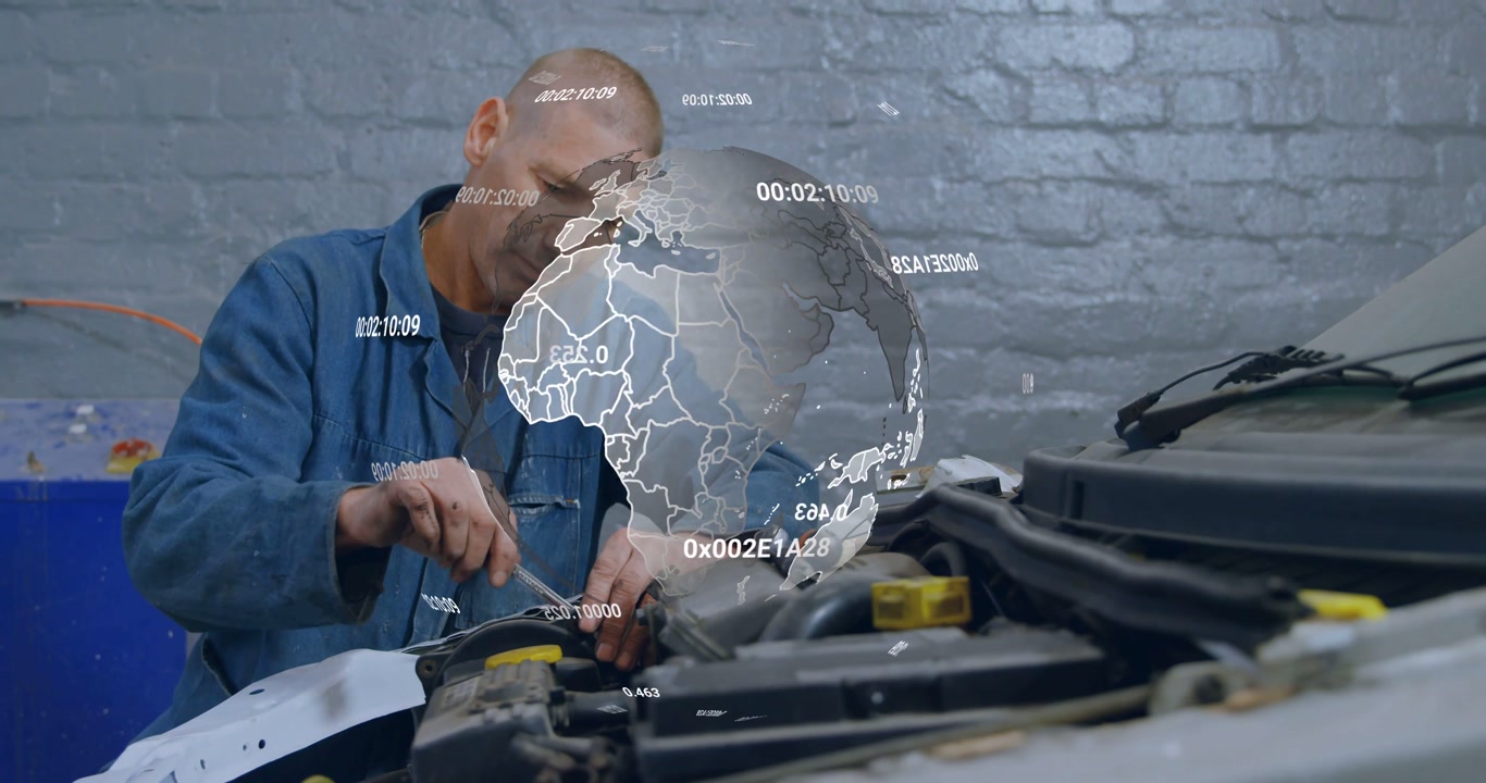 Auto mechanic gripping screwdriver and tightening bolt at hood, data globe crossing torso, securing
