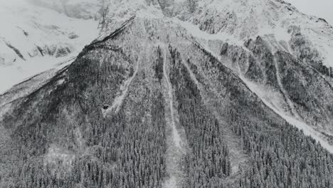 Dombay-snow-mountains-caverns-and-small-town-view-from-aerial