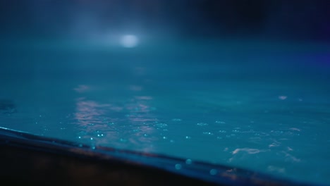 closeup of bubbles in pool at night