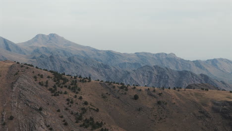orbit aerial shot of majestic sierra de la ventana under a cloudy sky