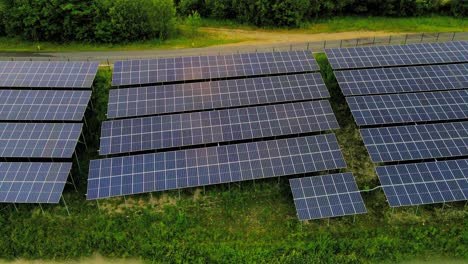 Captivating-aerial-4K-drone-footage-of-a-solar-panel-plant-nestled-alongside-the-Drava-river-in-Slovenia