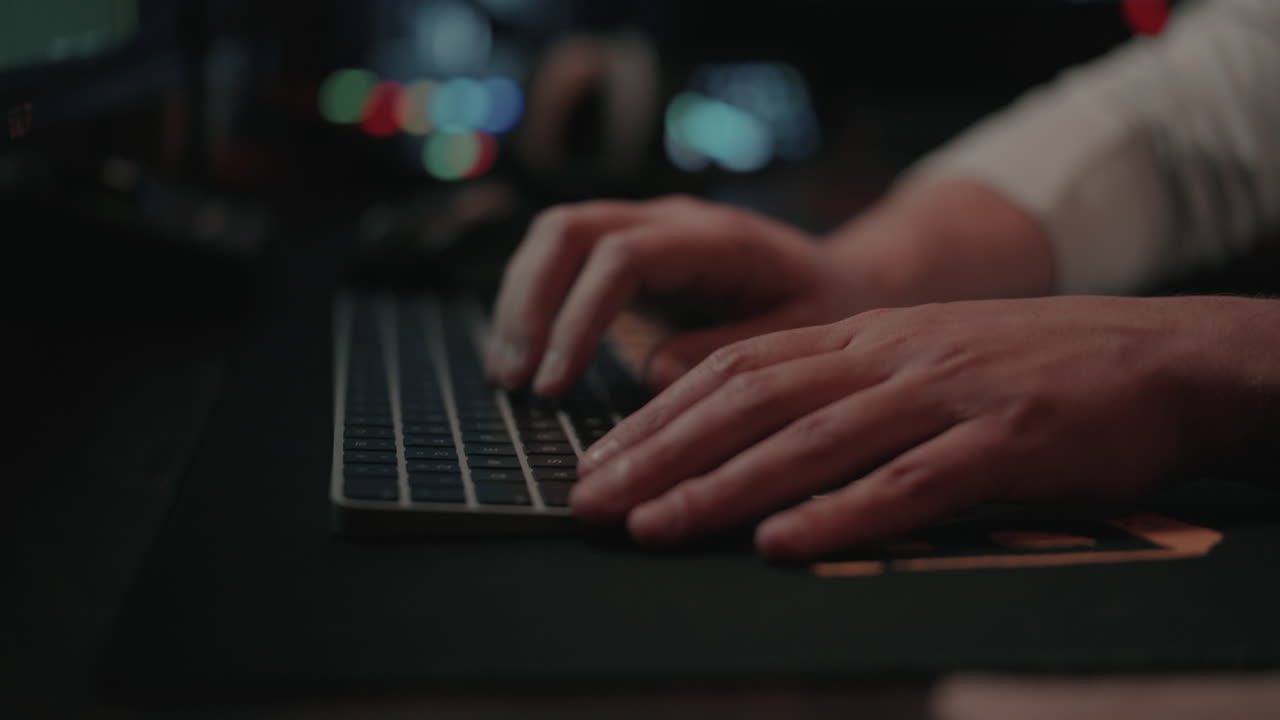 Person working on a computer at night