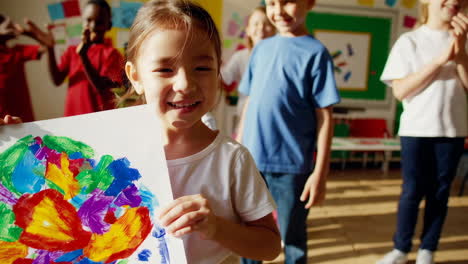happy children creating colorful paintings in art class