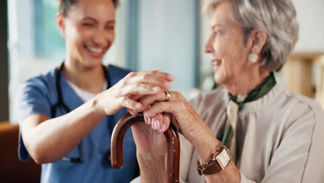 nurse assisting elderly woman with cane