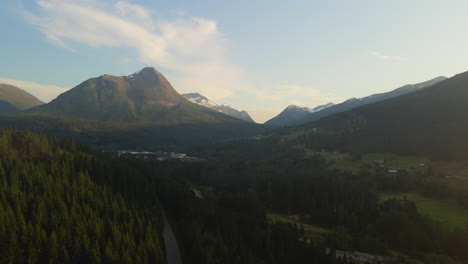 drone shot looking towards engeset and storhornet mountain in stranda, norway