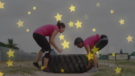 lifting large tire, two people exercising with star animation overlay
