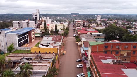 Aerial-footage-of-cloudy-Obera-city,-Argentina,-showing-old-buildings