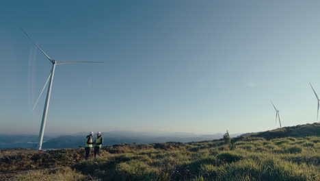 two engineers having discussion at wind farm