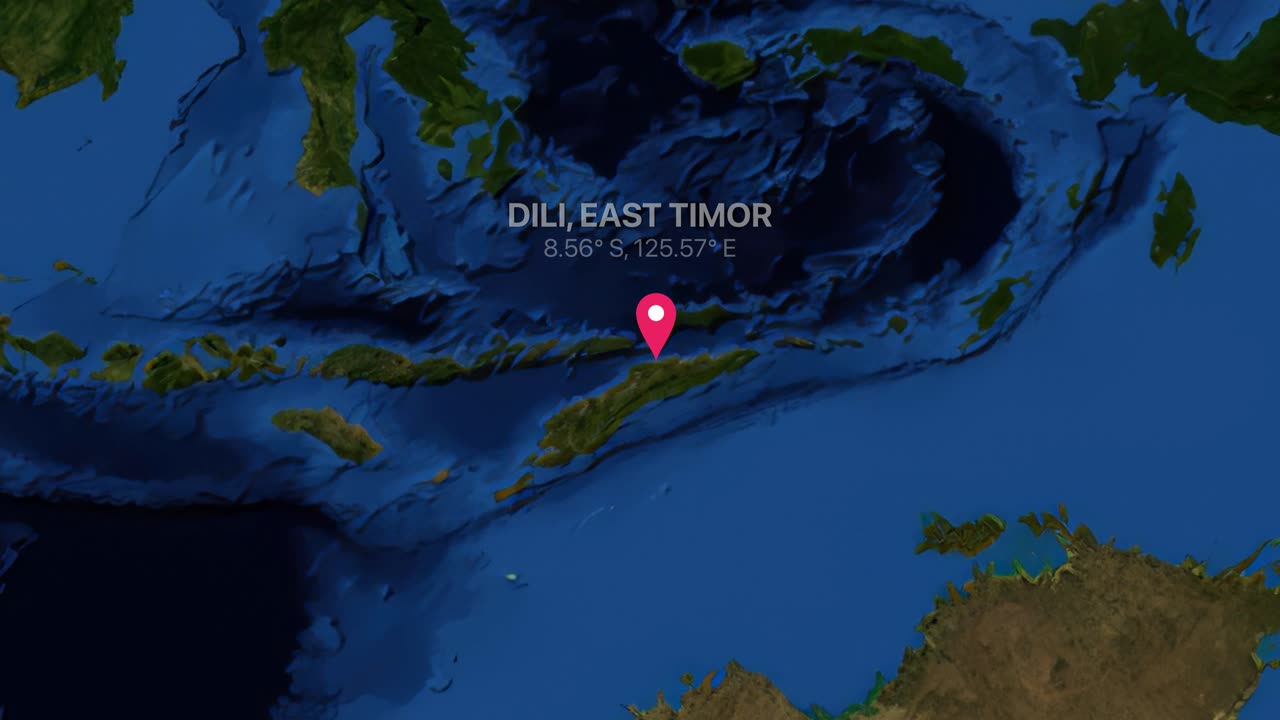 Mappa satellitare del mondo che ingrandisce il Sud-est asiatico, evidenziando Dili, Timor Est con un segnaposto rosso