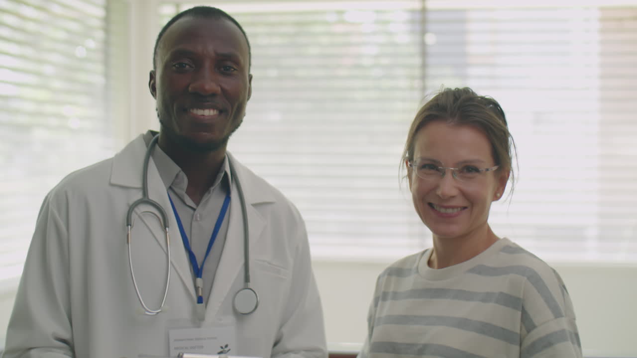 Portrait of Diverse Doctor and Patient in Medical Office
