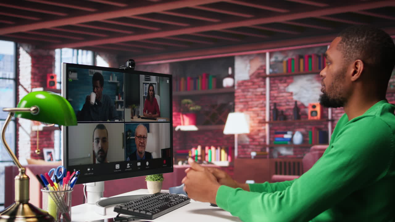 Vertical Video Remote worker looking at PC monitor discussing with coworkers