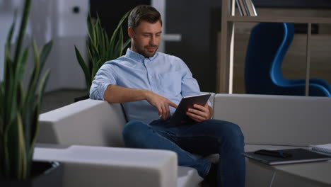 focused businessman using tablet