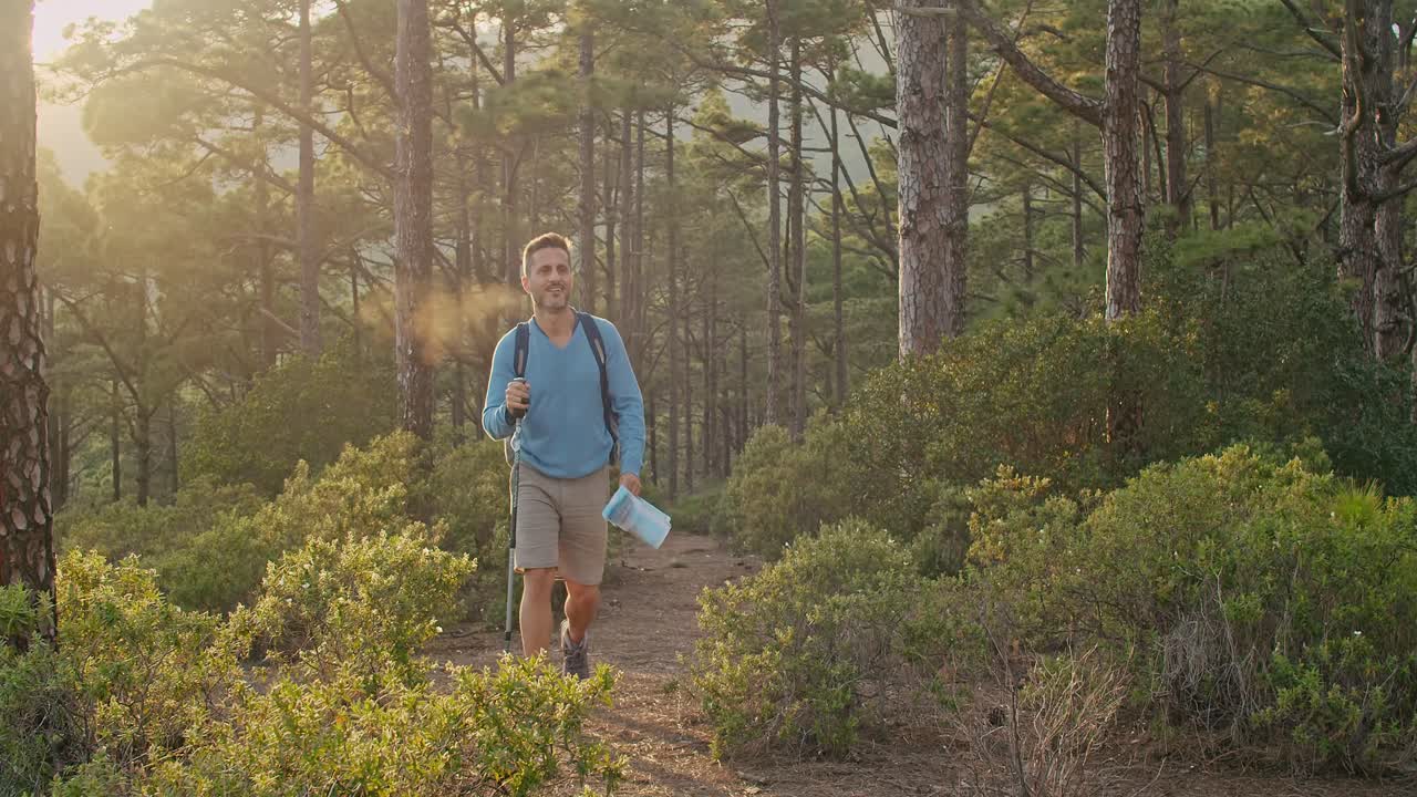 Male hiker walking in forest