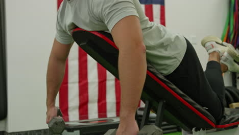 man train on sports training equipment in a fitness gym