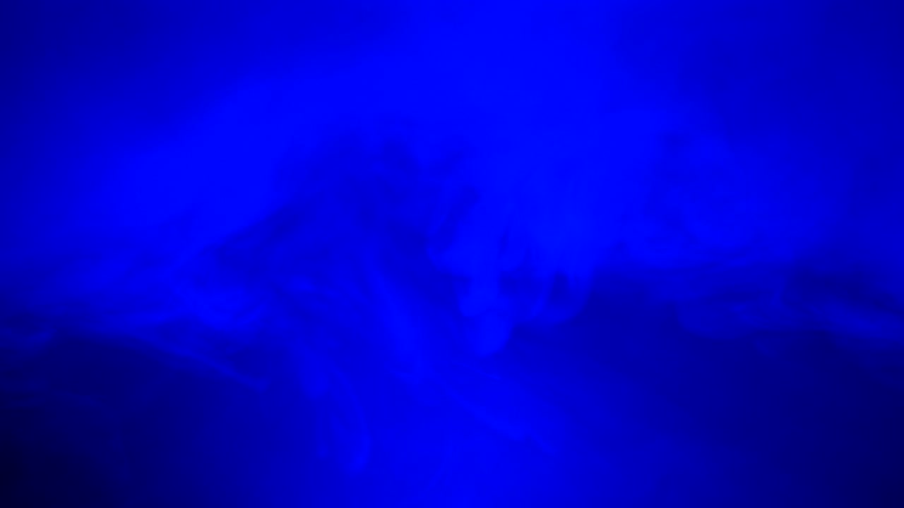 Ambient, abstract, sci fi, ethereal blue smoke and light motion background for mystical, dreamlike, background atmosphere with calm, serene slow motion fog and moving smoke and light.