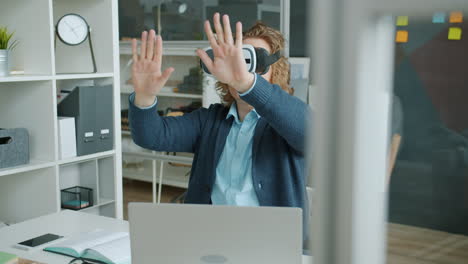 person using vr headset in an office
