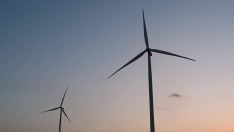 Wind-Turbines-Silhouette-against-the-Blue-sky-during-Sunset,-clean-alternative-energy-in-Thailand-and-mainland-Southeast-Asia