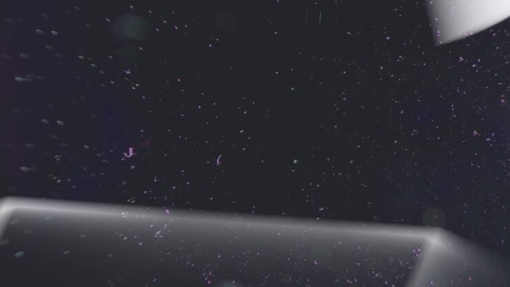Animation of mega sale in white text distorting over yellow neon triangles on black background