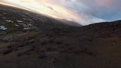 dramatic-and-cinematic-sunset-view-seen-from-mountain-ridge-over-Provo,-Utah