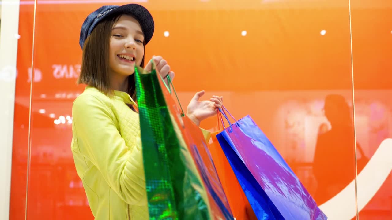 Happy Teenager Shopping in a Mall
