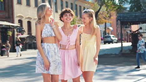 three friends laughing in the city streets