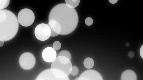 animación de manchas blancas en movimiento sobre fondo negro