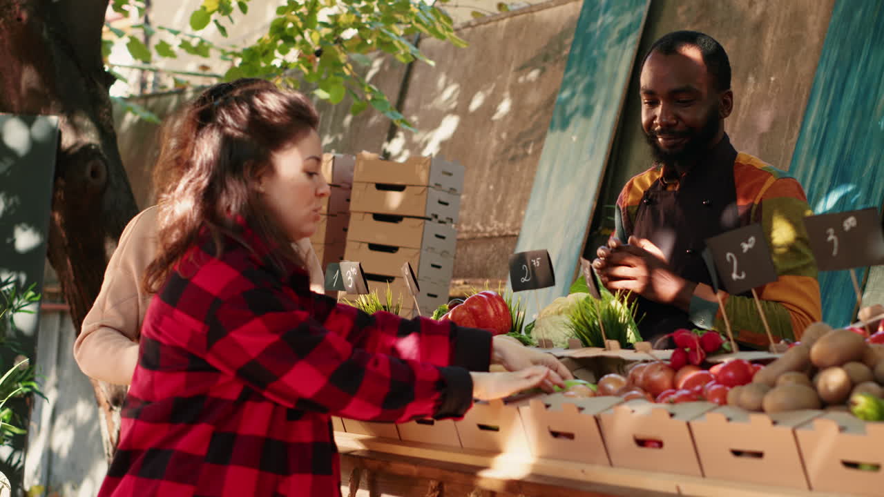 People Shopping for Produce at an Outdoor Market