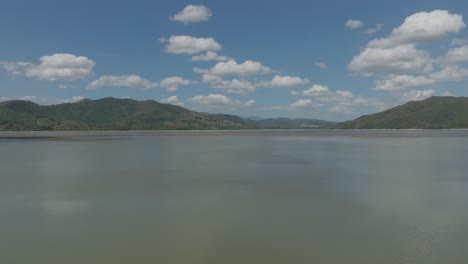 Birdseye-view-of-Aniana-Vargas-nature-reserve,-Hatillo-embankment-dam-on-Yuna-River-in-Dominican-Republic