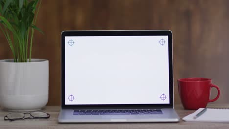 video of laptop on wooden table with copy space in office