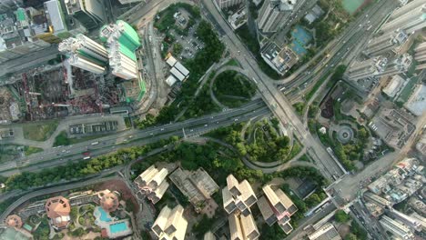 downtown hong kong city skyscrapers and urban traffic, aerial view