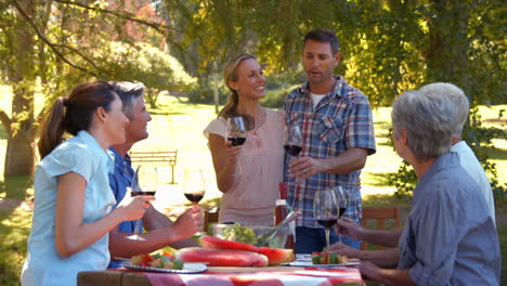 happy couple toasting with their family