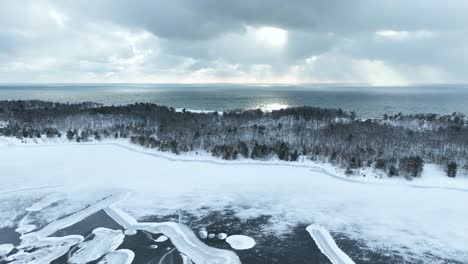 lake michigan's waters in the distance from above an inland lake