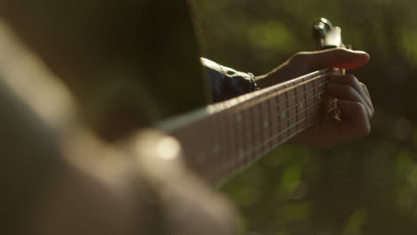 close-up of hands playing guitar and bass