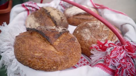 basket of freshly baked bread with a decorative cloth