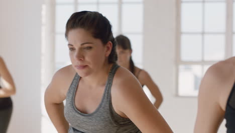 yoga-class-portrait-young-pregnant-caucasian-woman-practicing-poses-holding-belly-enjoying-group-exercise-in-fitness-studio